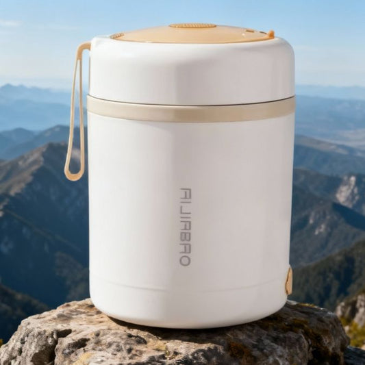 présentation d'une boite chauffante repas sur un rocher