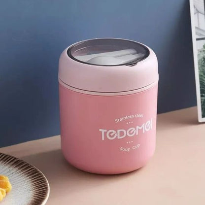 lunch box isotherme rose sur une table