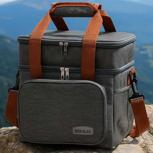 présentation d'un sac isotherme gris sur un rocher au sommet d'une montagne